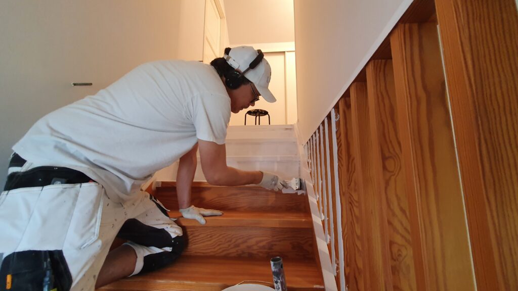 Priming wooden stairs.