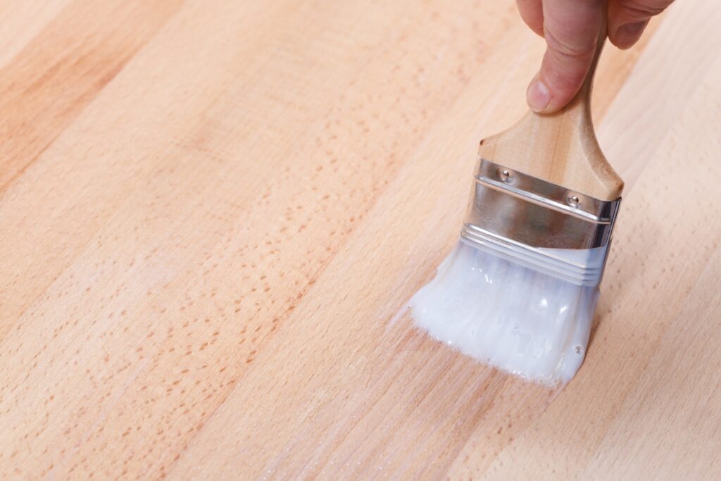 appling clear coat with synthetic bristled paintbrush